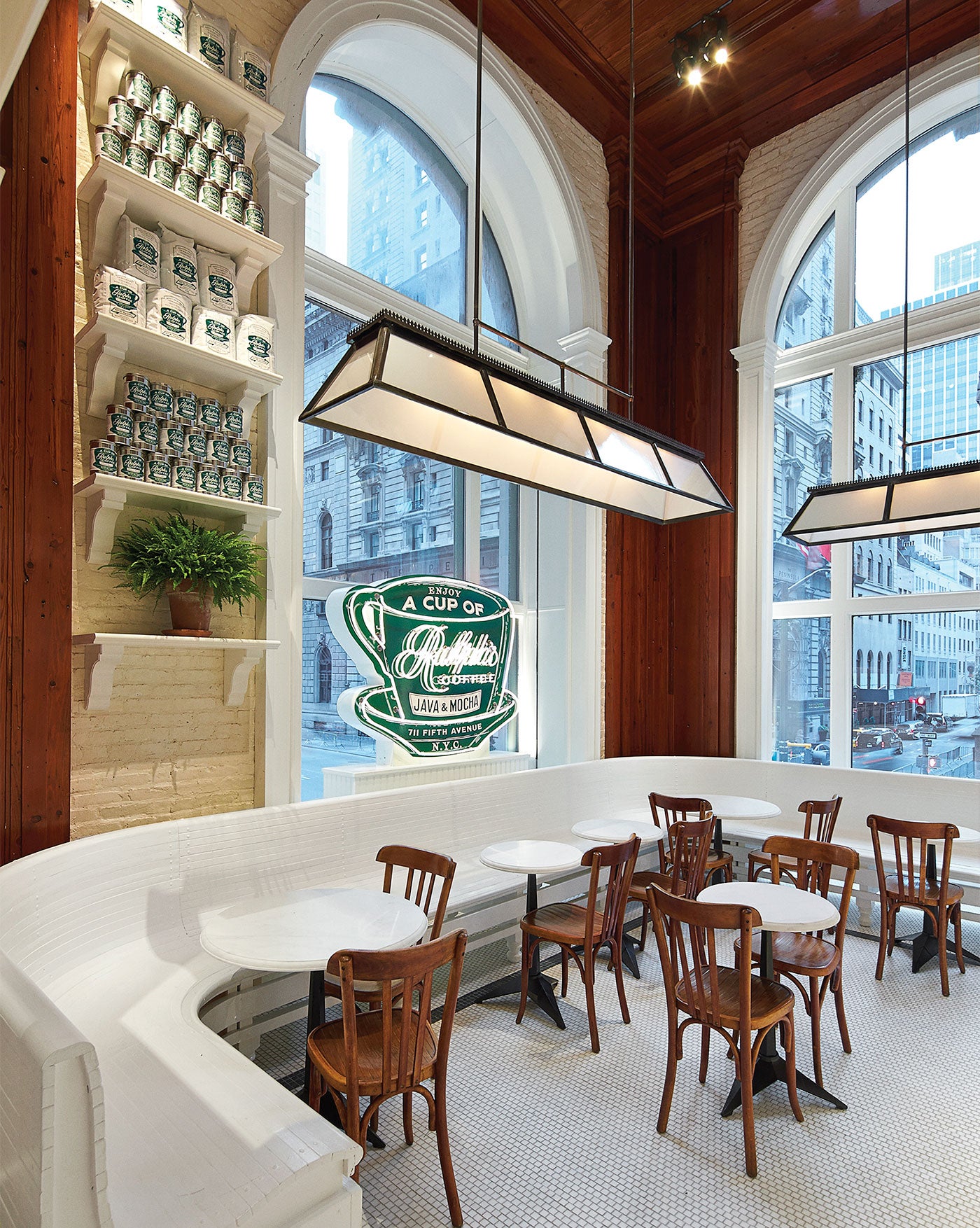  White marble, rich oak and painted brick walls add a sense of grandeur to the café’s casual space, inspired by the New York City coffee shops of Mr. Lauren’s youth