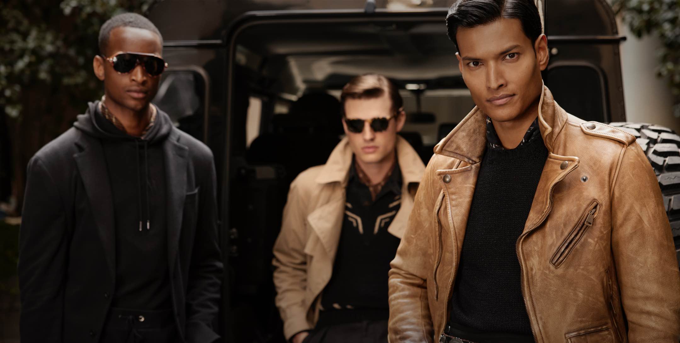 Men wear Purple Label jackets and sunglasses.
